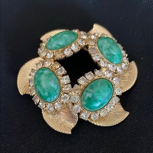 Gold and Green Pendant with Leaf Accents and Central Stones